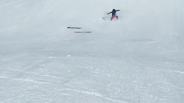 Person Falls And Tumbles Down Snow Slope While Skiing