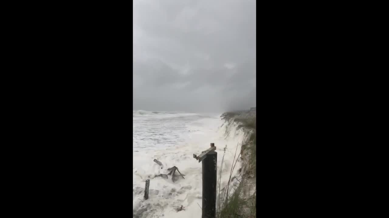 Waves pound dunes at Jacksonville Beach as Nicole moves north along Florida Coast