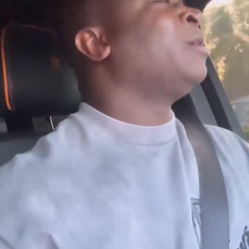 OT Genasis jamming out to some Mexican music in his Rolls Royce