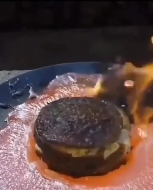 Epic video of a guy pouring lava over his McDonalds Big Mac.