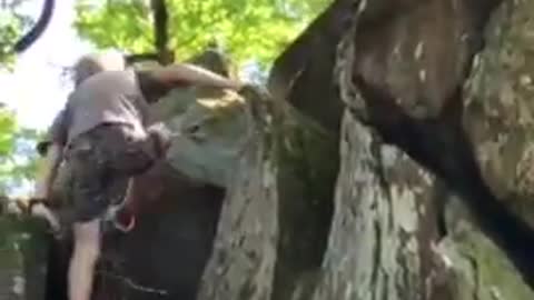 Kid Climbs Huge Rock Faces and Reaches Top of Rocky Terrain