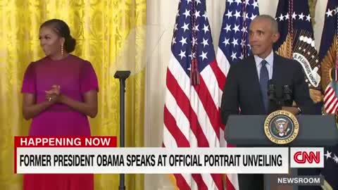 Barack Obama gives a speech after the unveiling of his White House portrait