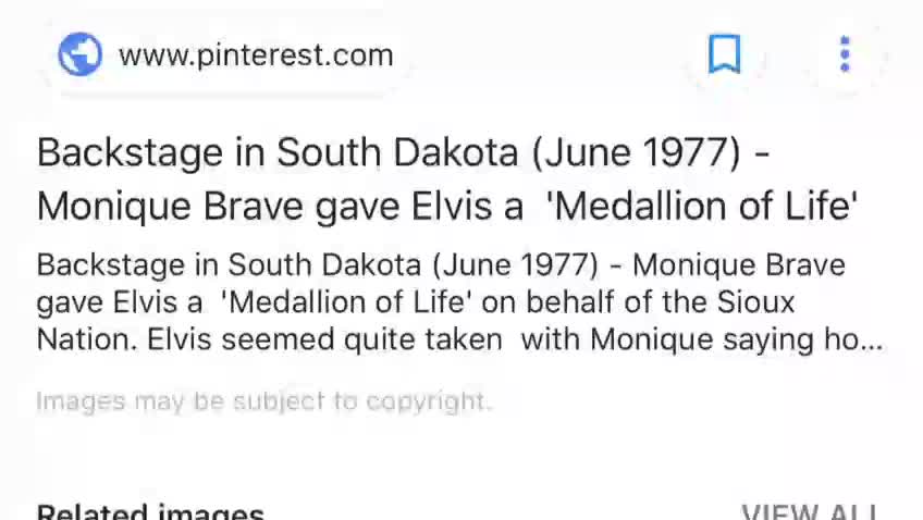 Elvis Presely receives a Medallion of Life from a Sioux tribe girl