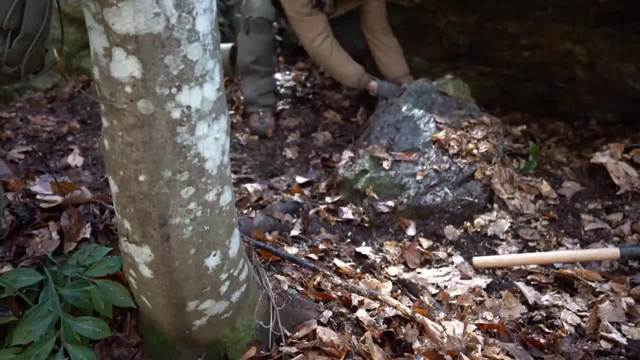 Four excavated shelter.Building underground bunker.Earth hut. primitive technology.Clay stone oven-8