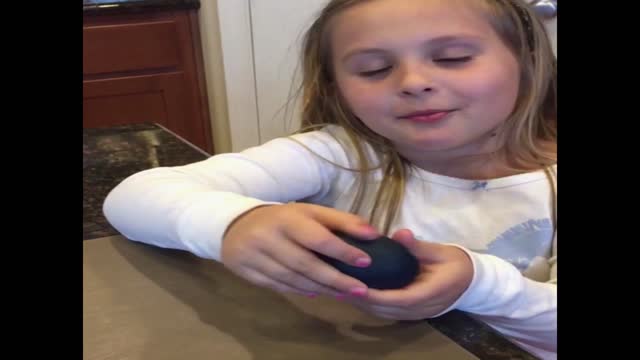 Girl fails to make a rubber egg