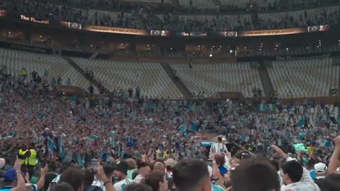 Lionel Messi is carried through the stadium after Argentina wins the 2022 FIFA World Cup final