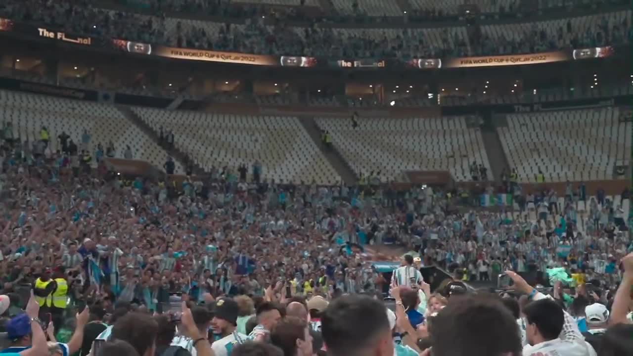 Lionel Messi is carried through the stadium after Argentina wins the 2022 FIFA World Cup final