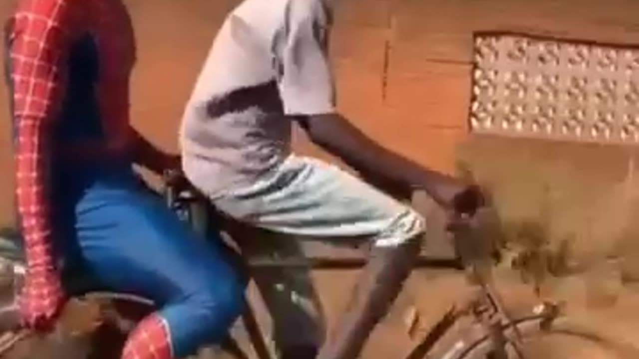 Spider Man on the bicycle with chicken