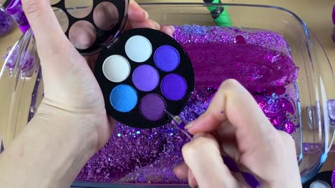 Purple slime mixing makeup"part "glitter into slime