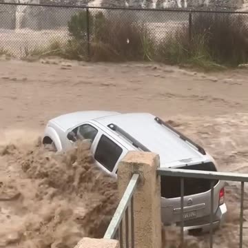 RAGING floodwaters sweep cars away in San Diego during record-breaking rainstorm