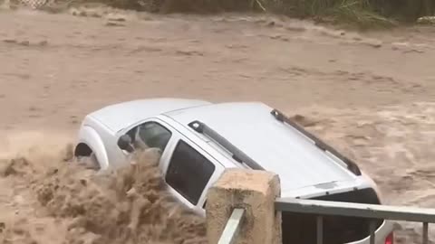 RAGING floodwaters sweep cars away in San Diego during record-breaking rainstorm