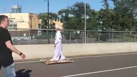 The flying Aladdin is easily chased by a DPSnik on a scooter