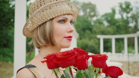 Blonde beautiful girl with Roses