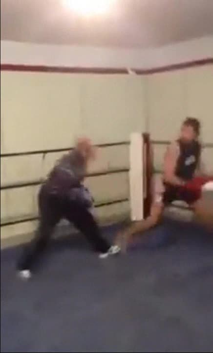 Young boxer is put at his place by an older more experienced boxer