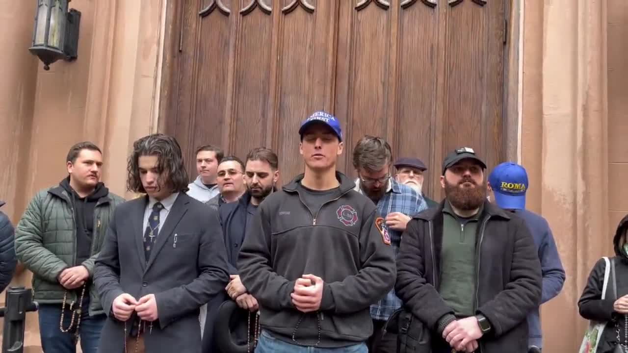 Catholics pray the rosary in front of pro abortion protesters