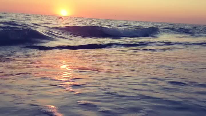 Slow motion waves at Sunset