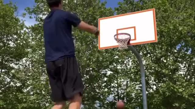 Guy Throws One Basketball in Basket While Standing Over Other and Makes Two Shots in Ro