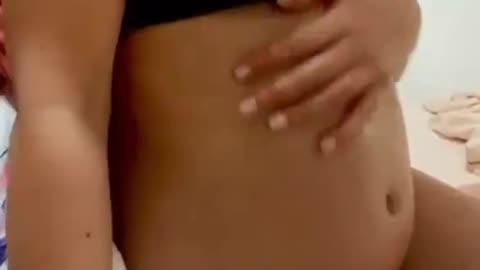 UNKNOWN YOUNG WOMAN HAS A PAIN IN HER PLUMP, OILED UP BELLY