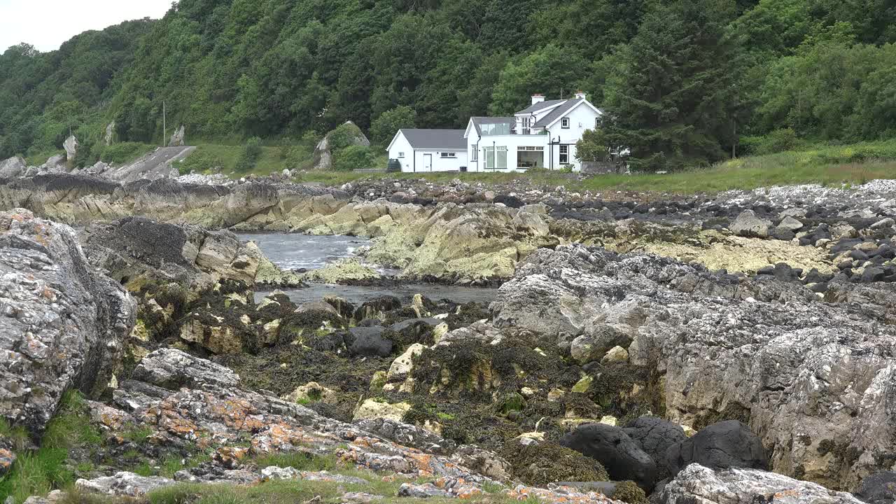 Northern Ireland Antrim House By Rocks And Sea