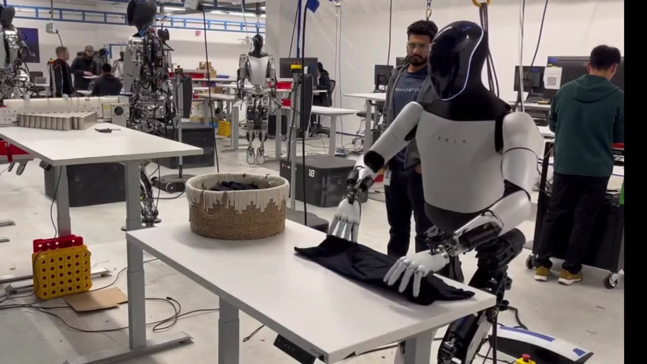 Tesla Robot Tesla Optimus Robot Folds Shirts - January 2024