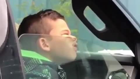 Boy a bored inside the car low quality videos