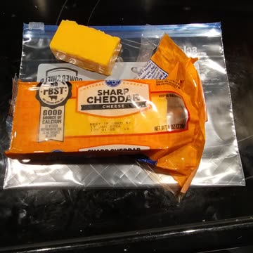 Eating Kroger Sharp Cheddar Cheese, Dbn, MI, 9/14/23