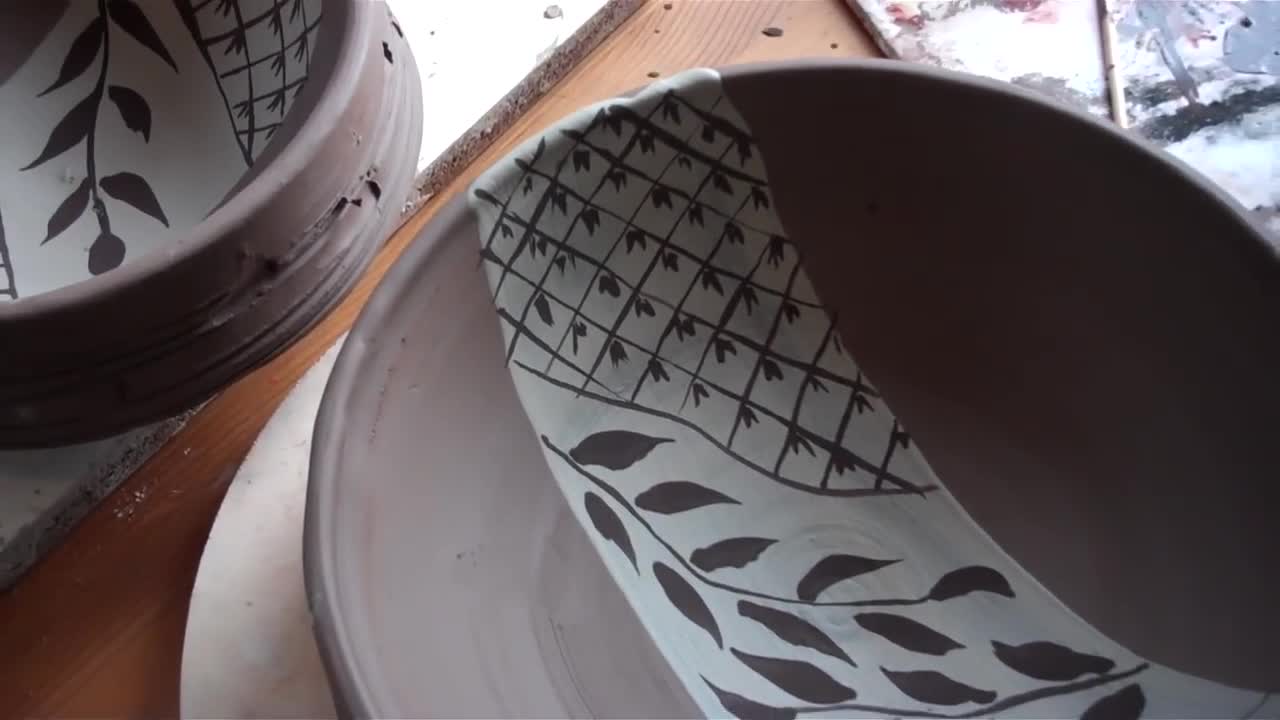 pottery brush decorating bowls, ready for oribe glazing