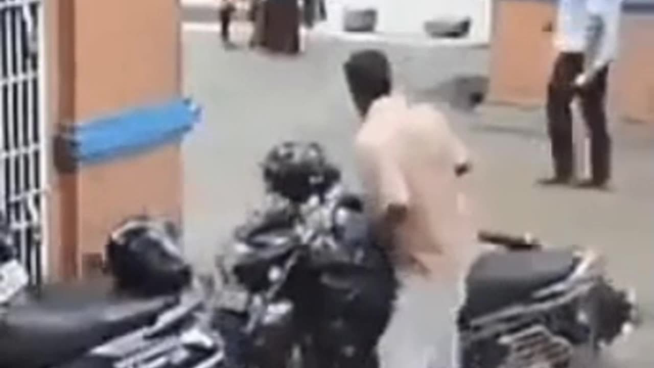 motorbike rider misjudges speed in to parking spot