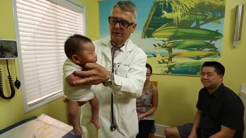 How To Calm A Crying Baby - Dr. Robert Hamilton Demonstrates