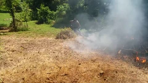 George tending to the bonfire.