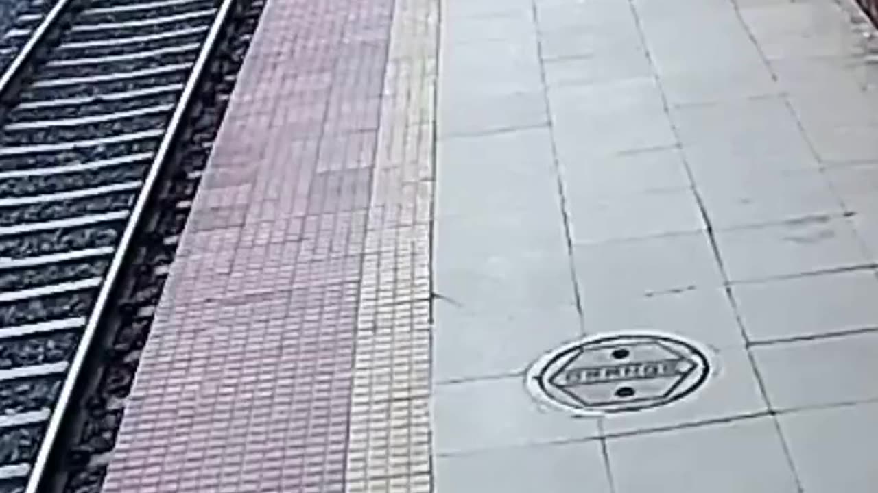 Mom Pushes Kid Onto Tracks