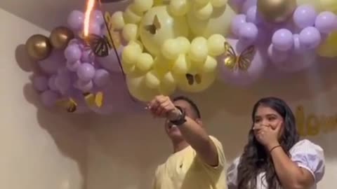 dude thinks it a good idea to pop helium balloon with a flame.