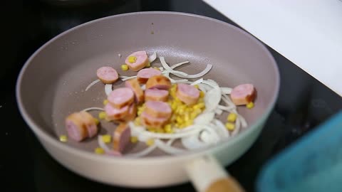 The hand of the cook using the induction stove