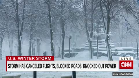 Woman tries to walk in deep snow after massive storm hits New York