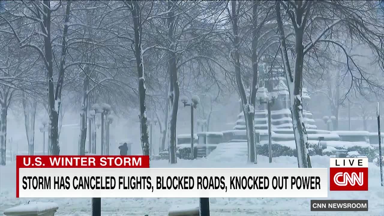 Woman tries to walk in deep snow after massive storm hits New York