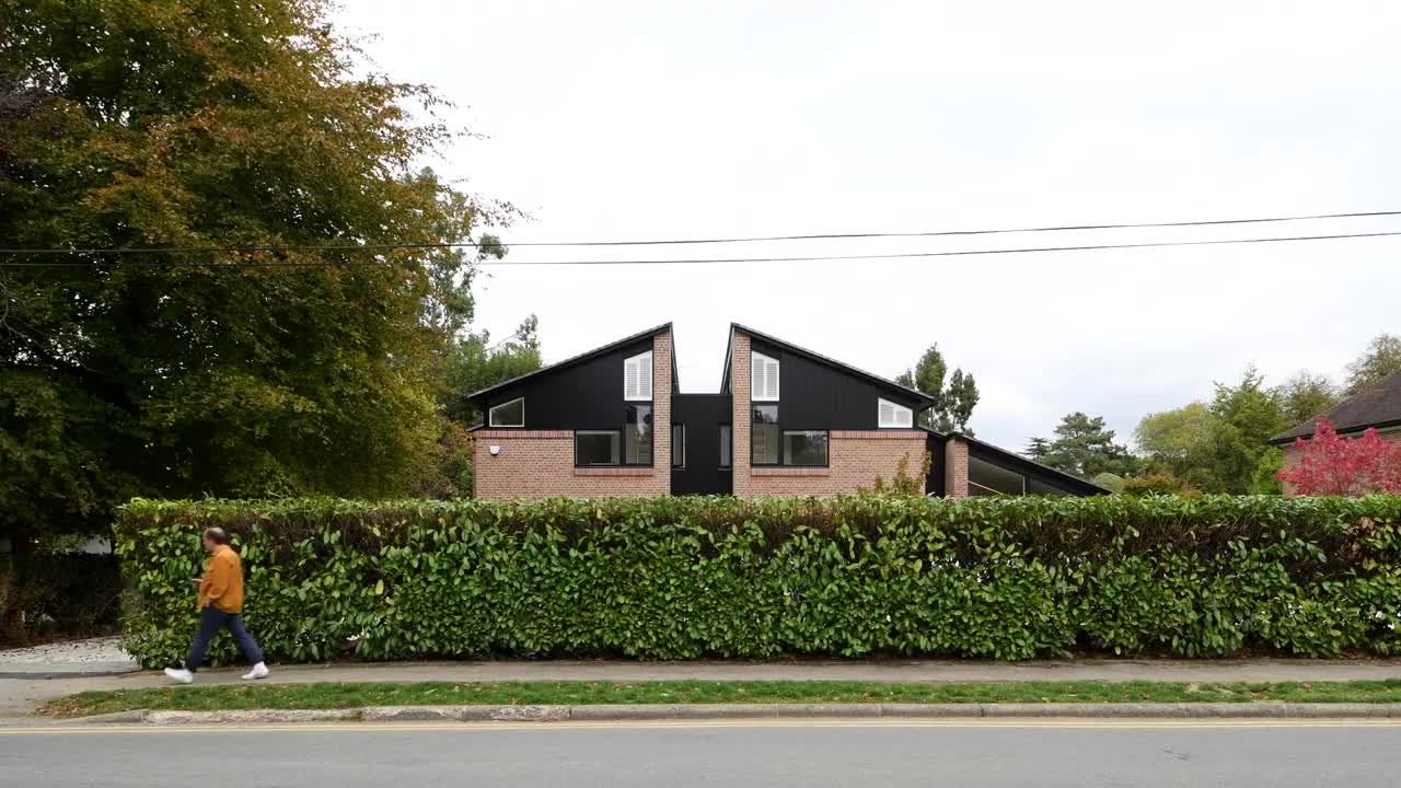 Cullinan Studio designs cracked open UK house with gaps to let in the light