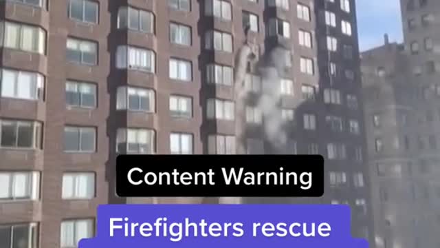 Firefighters rescue woman dangling from 20th-story window