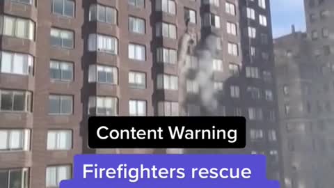 Firefighters rescue woman dangling from 20th-story window