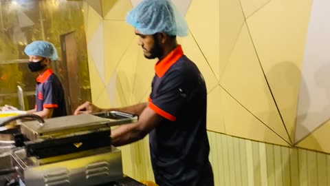 A Men Making Dosa