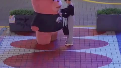 woman huged huge teddy bear in markete