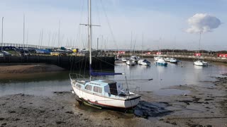 Nice boat at low tide at a mini harbour