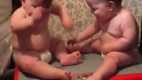 Baby laughing enjoy fun with bro