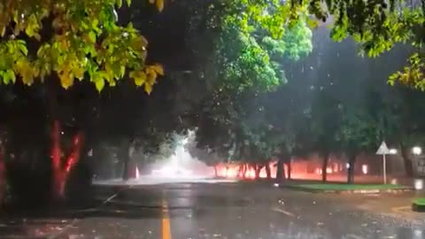 Rain on car window. Rainy night