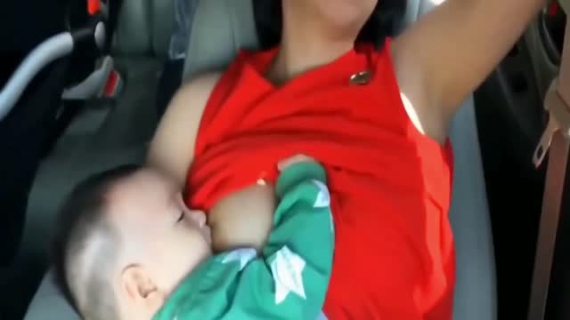 baby feeding milk ,in the car