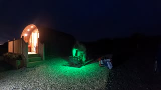 Preparing th fire pit for a campfire . Night lapse