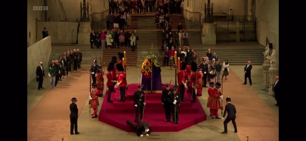 Royal guard at the Queen Elizabeth's coffin collapses