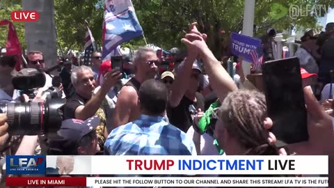 White Liberal calls Black man a Sellout at Miami Court House where President Trump was arrested.