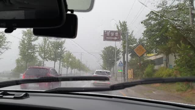 Drive in the afternoon in heavy rain