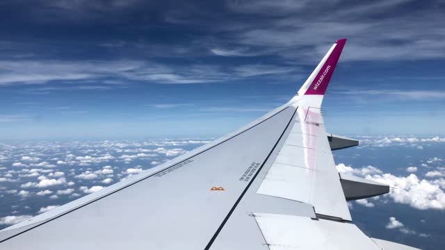 Airplane Wing Against Blue Sky