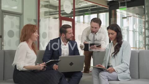 Work Team Composed Of Two Females And Two Males In A Meeting Put Things In Common 1